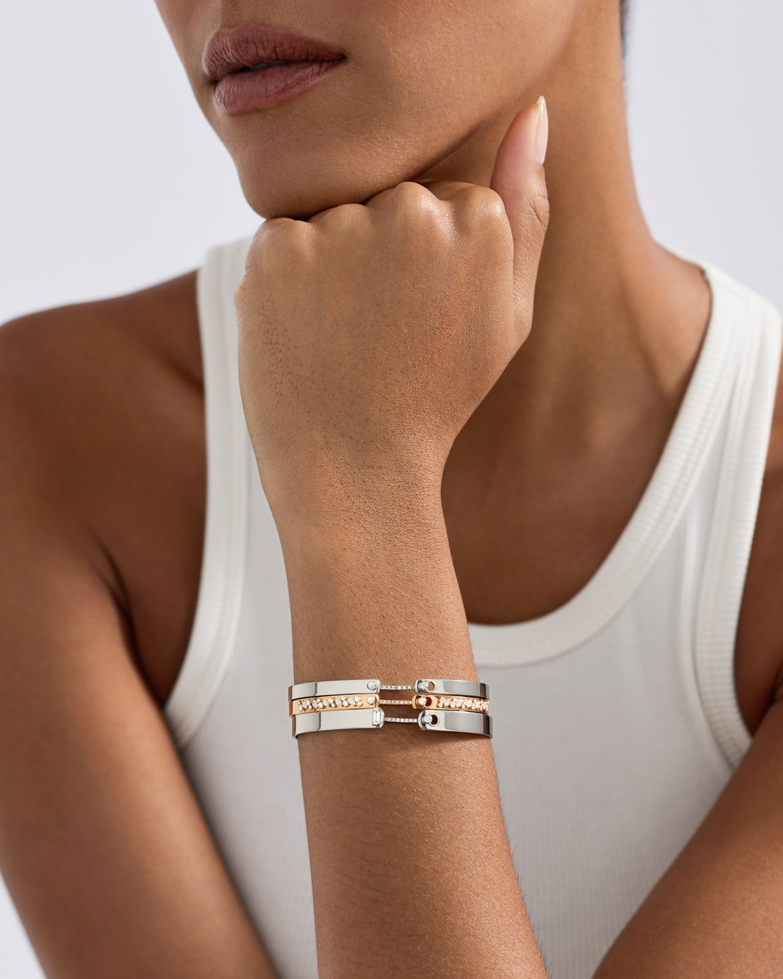 model wearing 3 mood bangles stacked