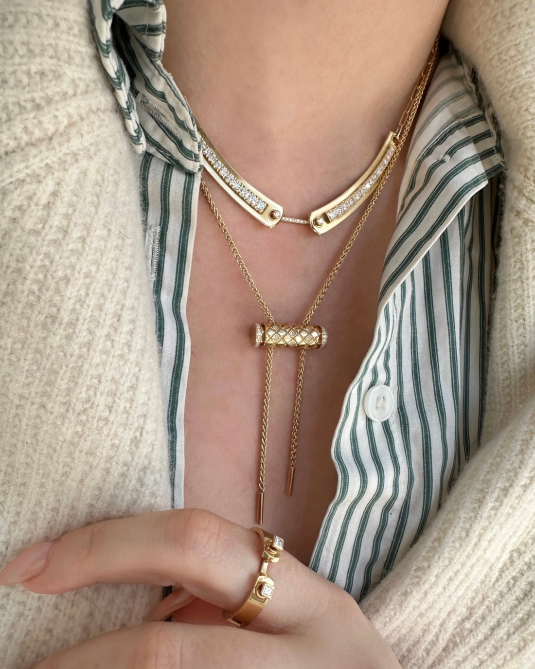 three necklaces worn in layers